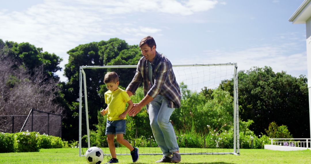 Father Playing Soccer with Young Son in Backyard - Free Images, Stock Photos and Pictures on Pikwizard.com