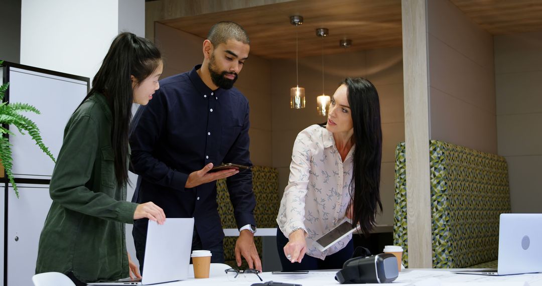 Collaborative Office Meeting with Diverse Team Members Discussing Ideas