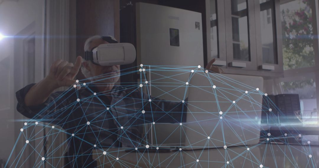 Mature Man in Virtual Reality Manipulating Digital Network in Kitchen