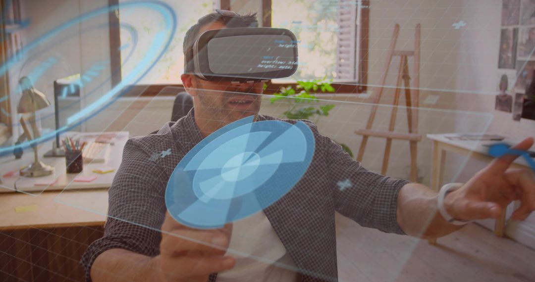 Mature man exploring virtual reality interface in creative studio workspace