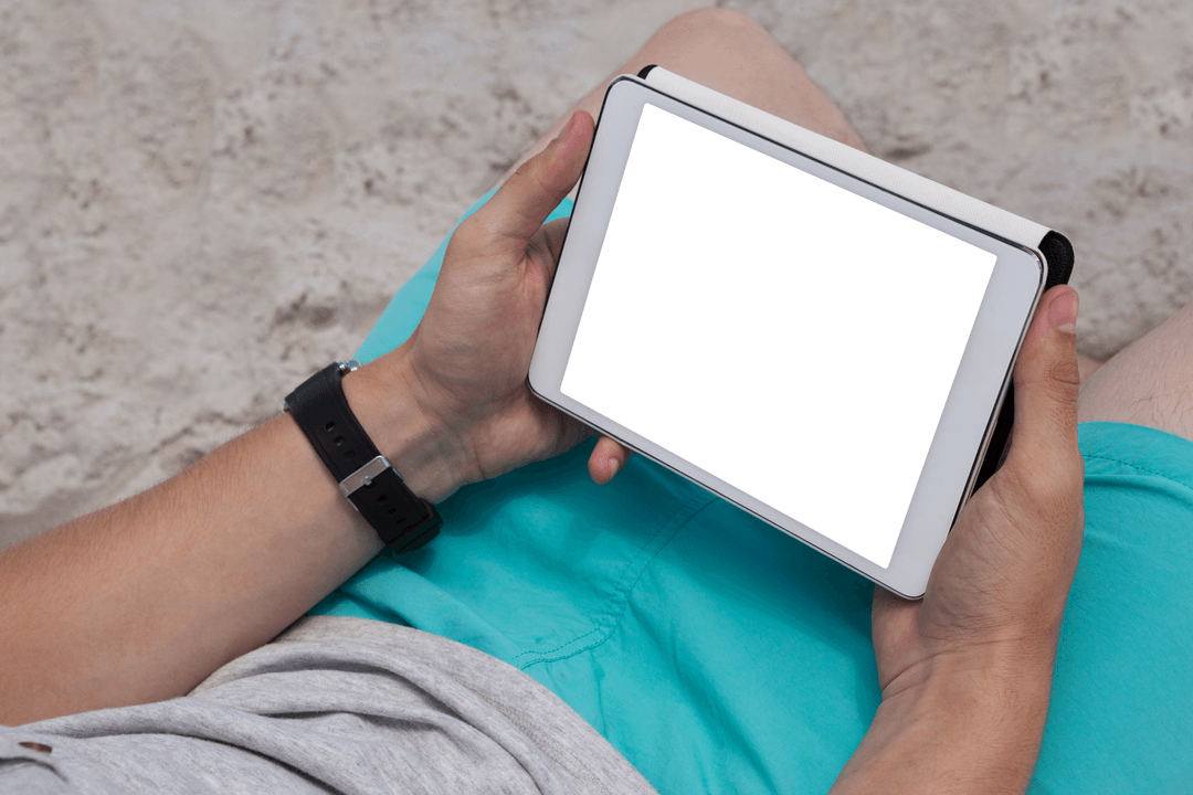 Man Holding Digital Tablet with Transparent Screen at Beach