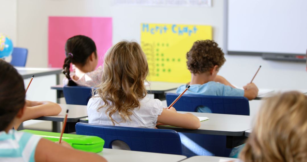 Young Students Learning Attentively in Modern Classroom