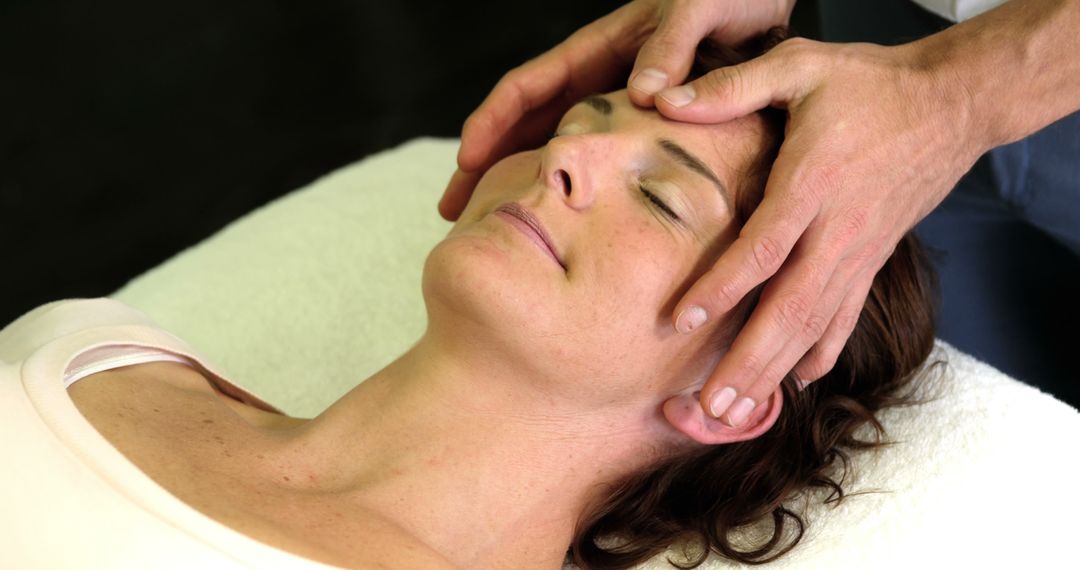 Close-up of Woman Receiving Relaxing Head Massage - Free Images, Stock Photos and Pictures on Pikwizard.com