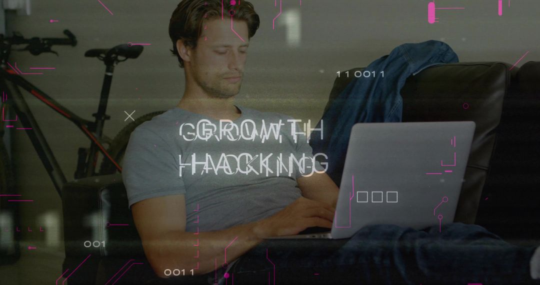 Man on Laptop Exploring Growth Hacking Concepts at Home