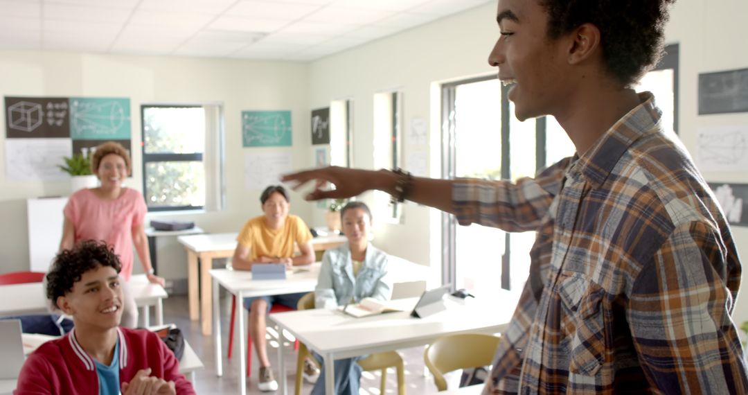 Teenage Student Presenting to Classmates in Classroom Setting