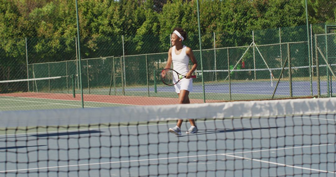 Female Tennis Player on Outdoor Court - Free Images, Stock Photos and Pictures on Pikwizard.com