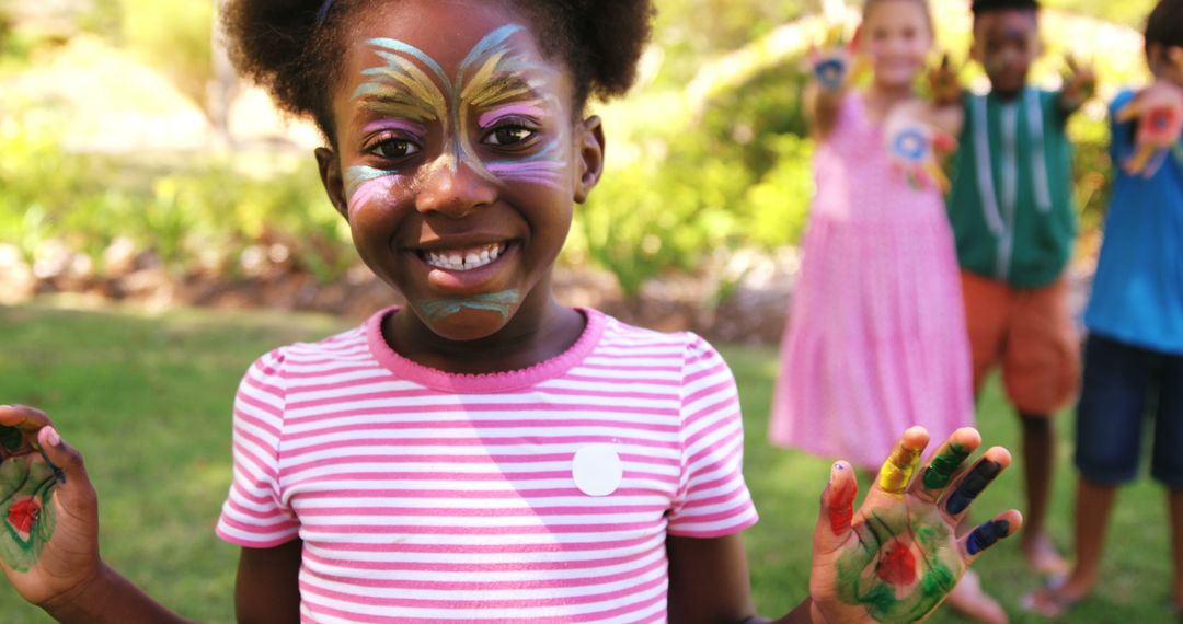 Happy African American Child with Face Paint Playing Outdoors - Free Images, Stock Photos and Pictures on Pikwizard.com