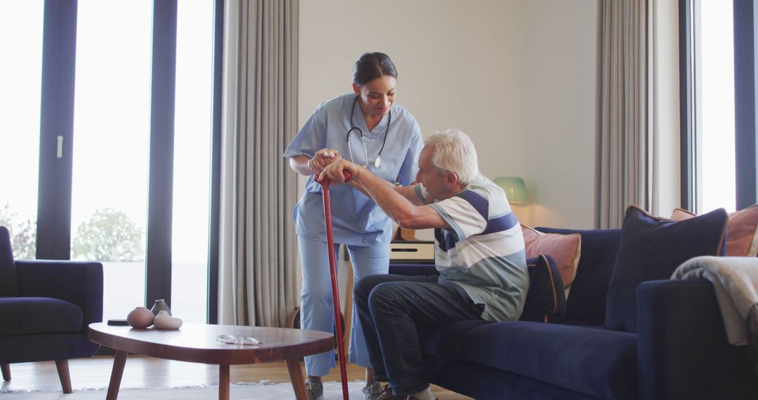 Nurse Assisting Senior Man at Home with Walking Cane - Free Images, Stock Photos and Pictures on Pikwizard.com