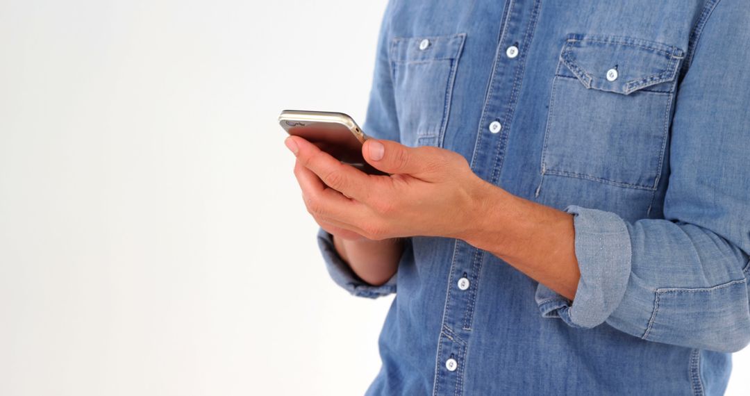 Casual Man Engaging with Smartphone Technology