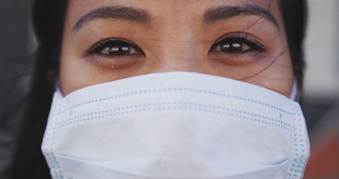 Close-Up of Asian Woman Wearing Protective Face Mask - Free Images, Stock Photos and Pictures on Pikwizard.com