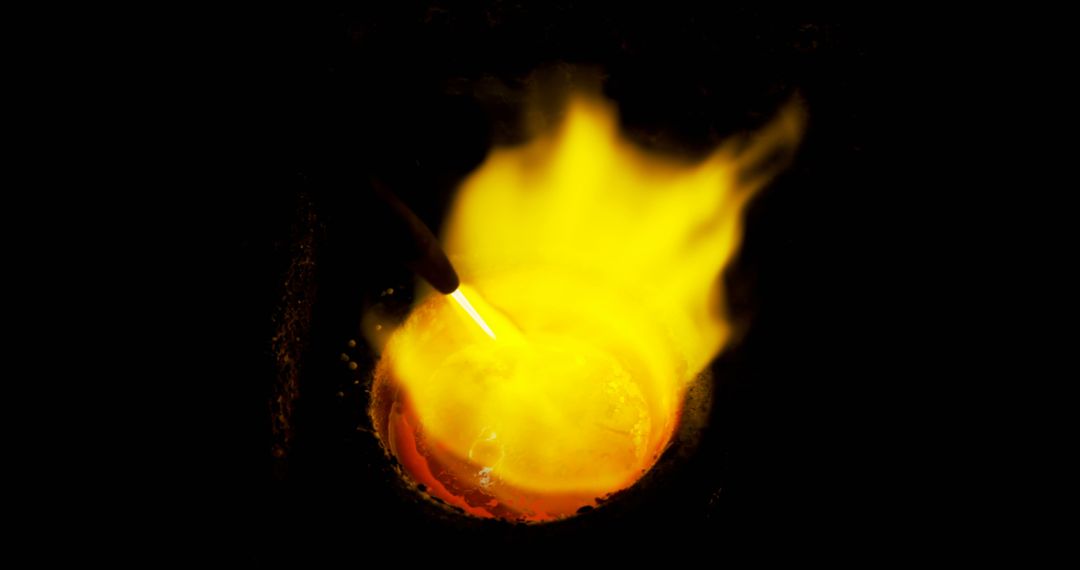 Molten Metal Pouring into Crucible with Intense Heat and Bright Flame - Free Images, Stock Photos and Pictures on Pikwizard.com