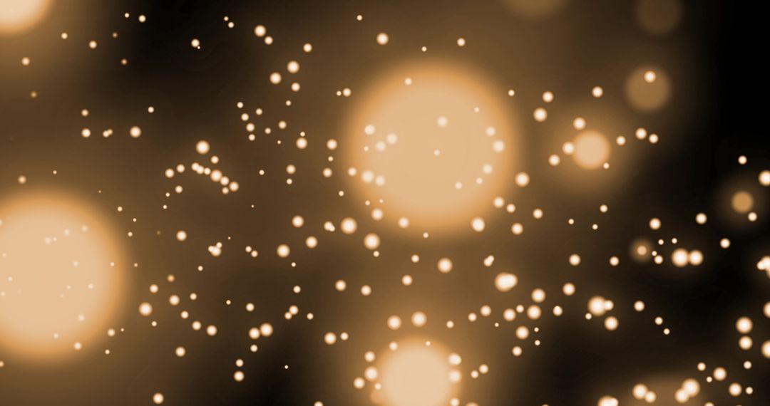 Glowing Gold Bokeh Lights Sparkling in Motion against Black