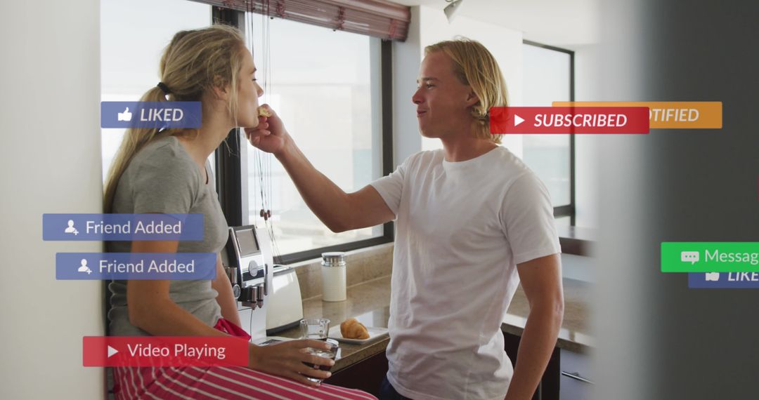Happy Couple Interacting with Social Media Notifications in Kitchen