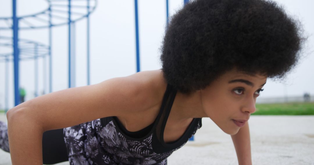 African American Woman Doing Push-ups in Outdoor Fitness Park - Free Images, Stock Photos and Pictures on Pikwizard.com