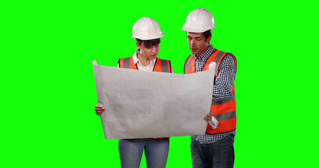 Engineers Discuss Blueprints in Safety Gear with Green Screen - Free Images, Stock Photos and Pictures on Pikwizard.com