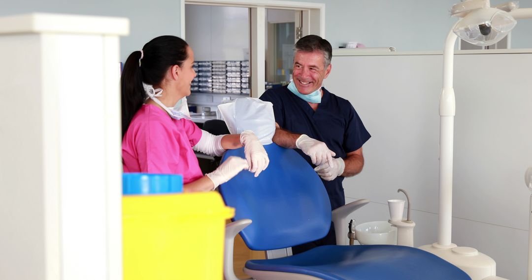 Dentist and Assistant Collaborating in Modern Dental Clinic - Free Images, Stock Photos and Pictures on Pikwizard.com