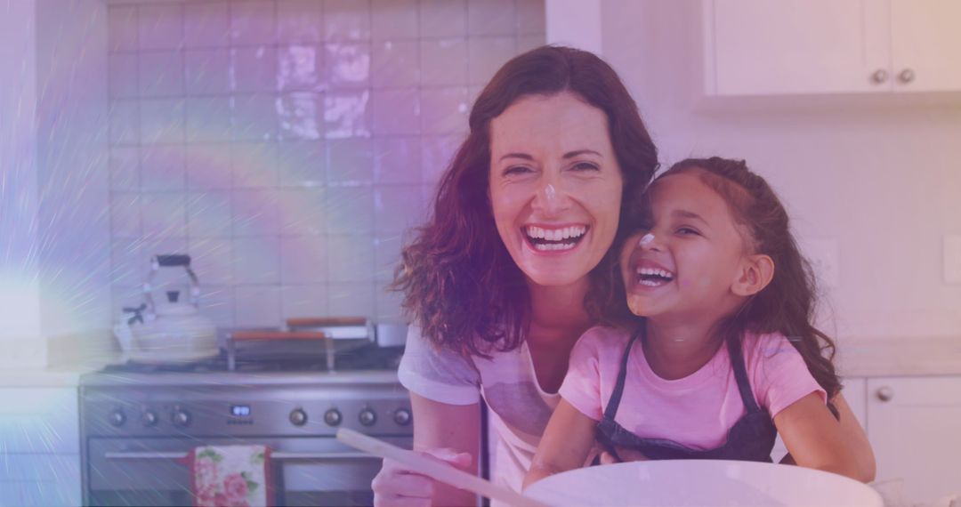 Smiling Mother and Daughter Cooking Together in Kitchen