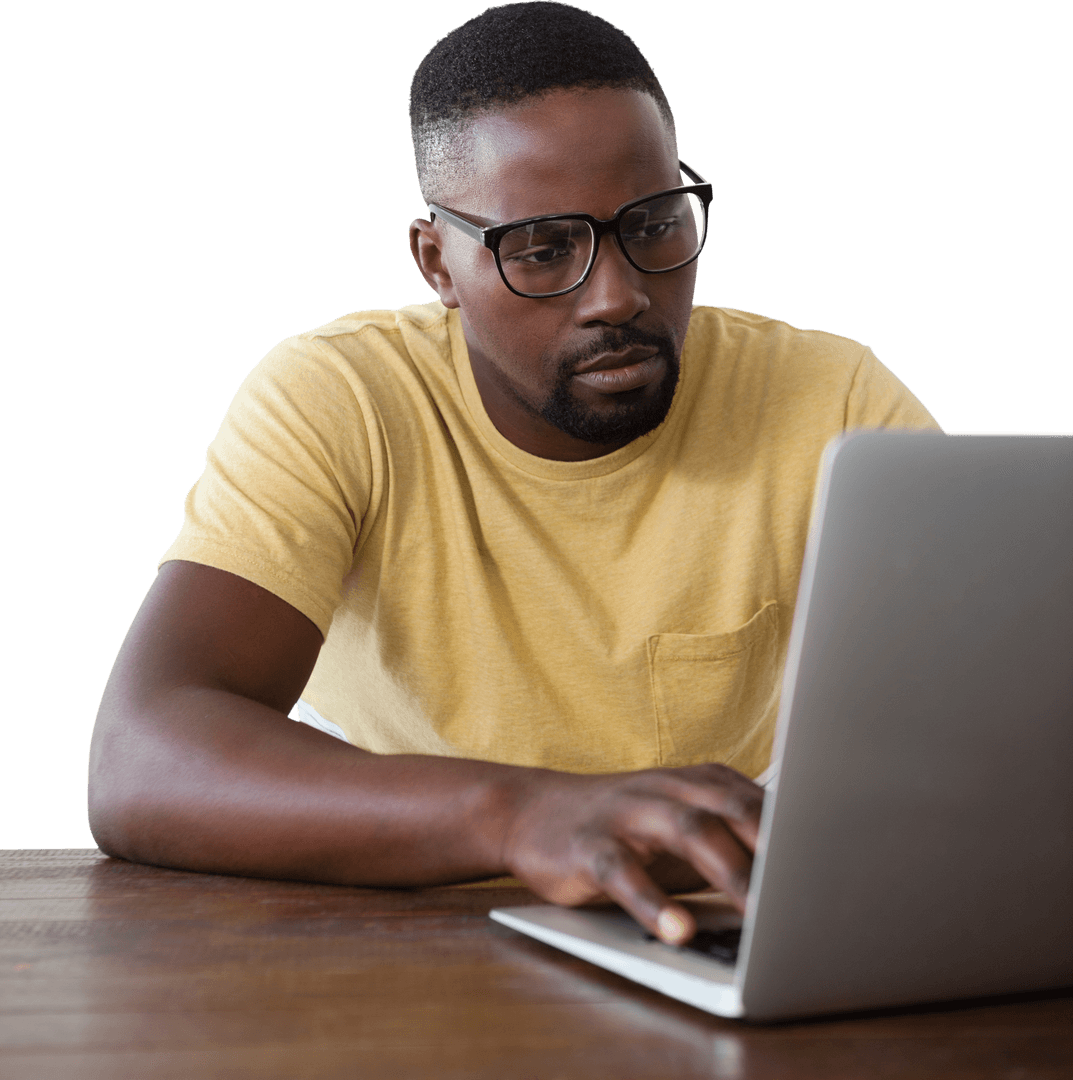 Focused Man with Glasses Using Laptop Looking Concentrated on Work