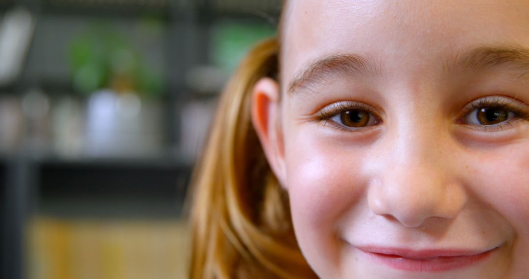 Close-up of Red-haired Young Girl Smiling at Camera