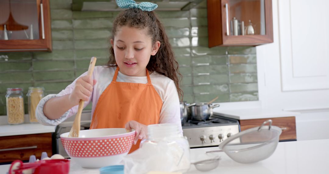 Young Girl Baking in Modern Kitchen, Wearing Orange Apron - Free Images, Stock Photos and Pictures on Pikwizard.com