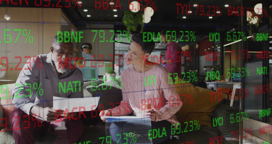 Diverse Colleagues Analyzing Financial Stocks in Modern Office
