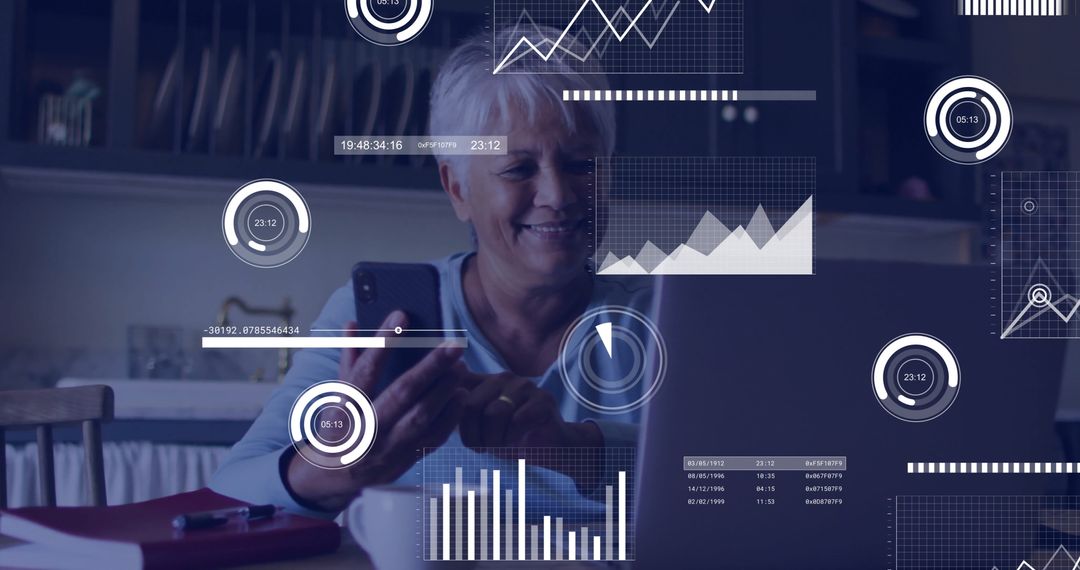 Senior Woman Analyzing Data on Laptop with Smartphone Interaction