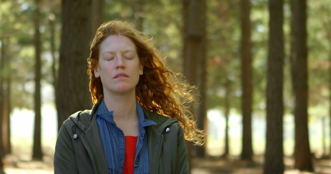 Woman Meditating in Forest with Sunlight Filtering Through Trees - Free Images, Stock Photos and Pictures on Pikwizard.com