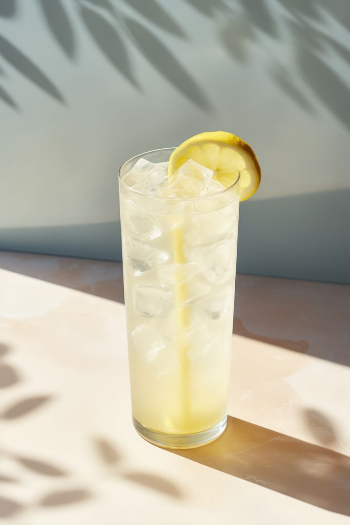 Refreshing Glass of Lemonade on Sunny Marble Surface - Free Images, Stock Photos and Pictures on Pikwizard.com