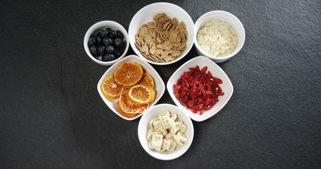 Assorted Healthy Snacks in White Bowls on Dark Background - Free Images, Stock Photos and Pictures on Pikwizard.com