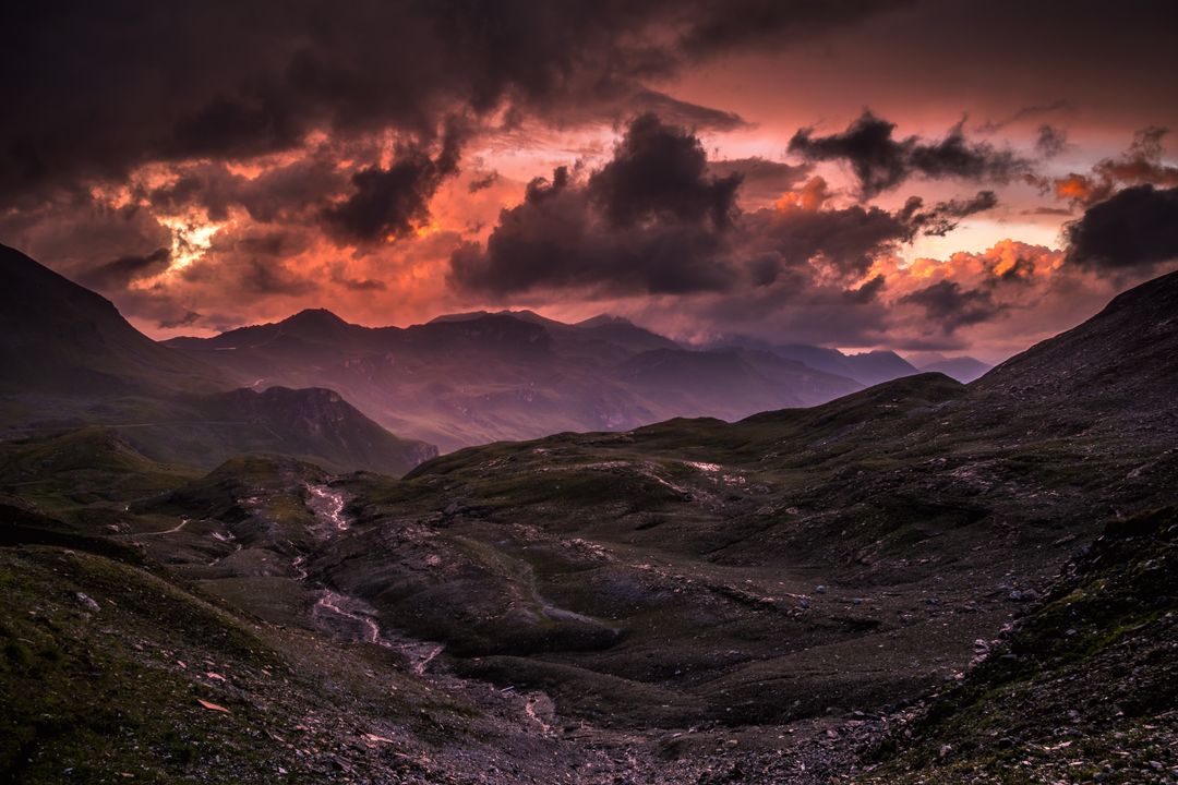 Dramatic Sunset over Mountain Range with Shadows and Vibrant Colors