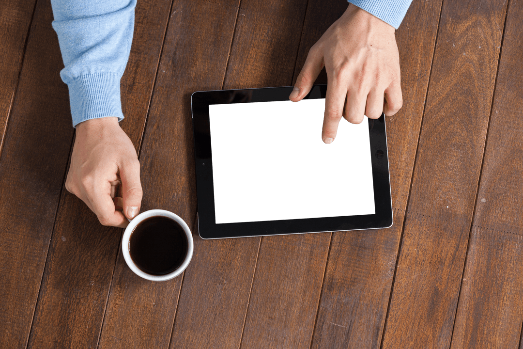 Transparent Tablet Interaction with Coffee on Rustic Table