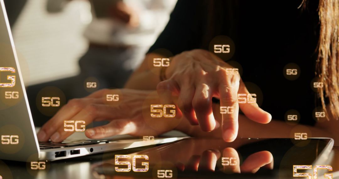 Hands Using Laptop and Tablet with 5G Technology Symbols