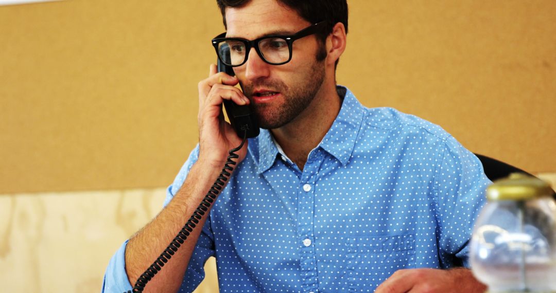 Businessman Talking on Phone in Modern Office - Free Images, Stock Photos and Pictures on Pikwizard.com