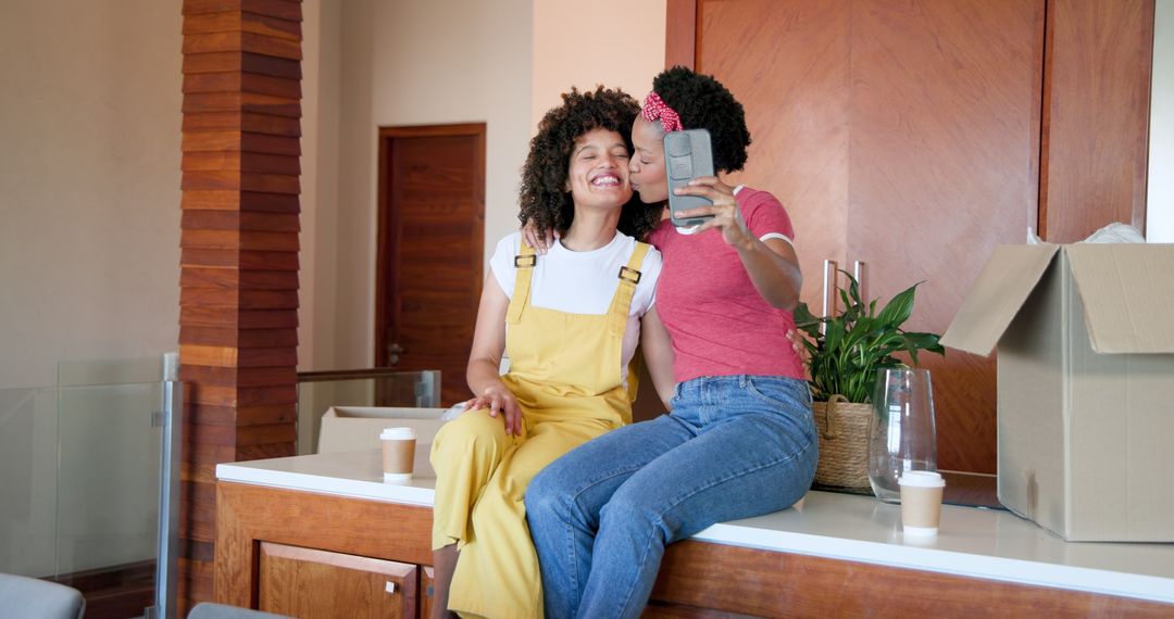 Two Friends Smiling While Taking a Selfie