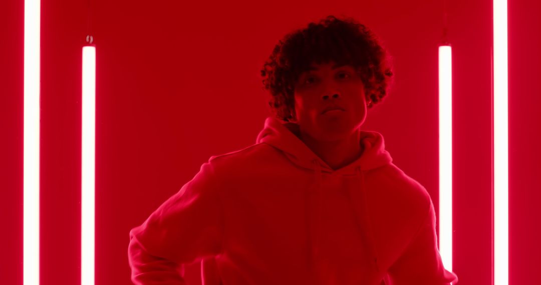 Dramatic Portrait of a Man in Neon Red Light with Minimalist Style