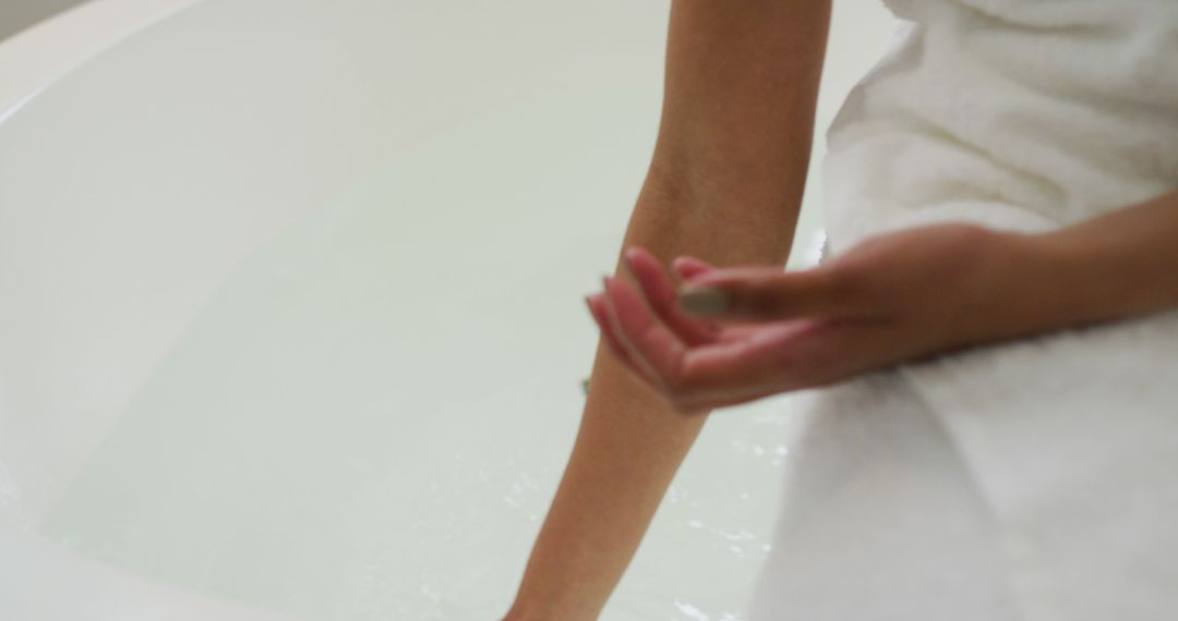 Person Relaxing in Bathtub with Soft Light - Free Images, Stock Photos and Pictures on Pikwizard.com