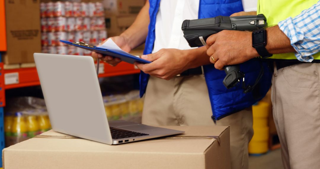 Warehouse Workers Using Laptop and Barcode Scanner for Inventory Control - Free Images, Stock Photos and Pictures on Pikwizard.com