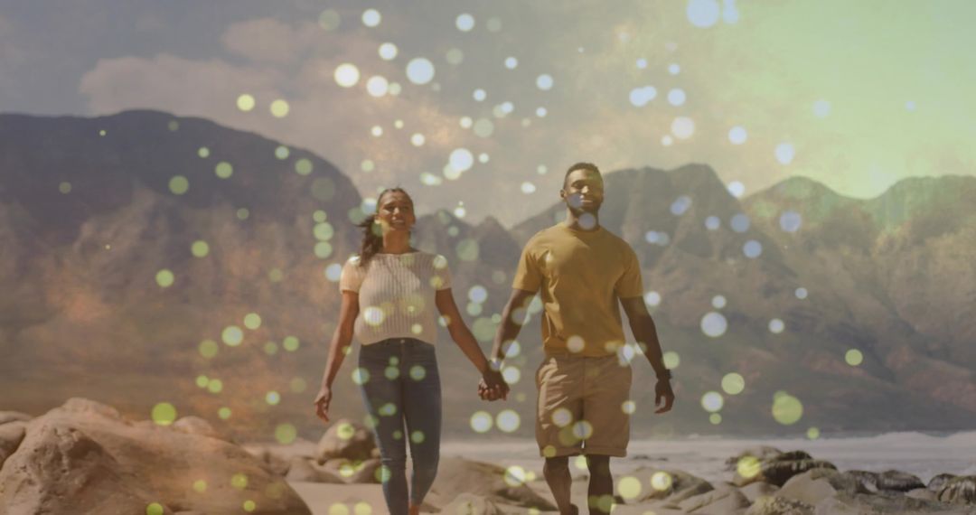 Romantic Couple Holding Hands on Mountainous Shore with Bokeh Effect