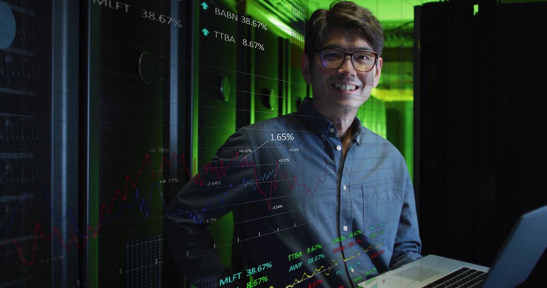 Asian IT Engineer Analyzing Financial Data on Computer Servers