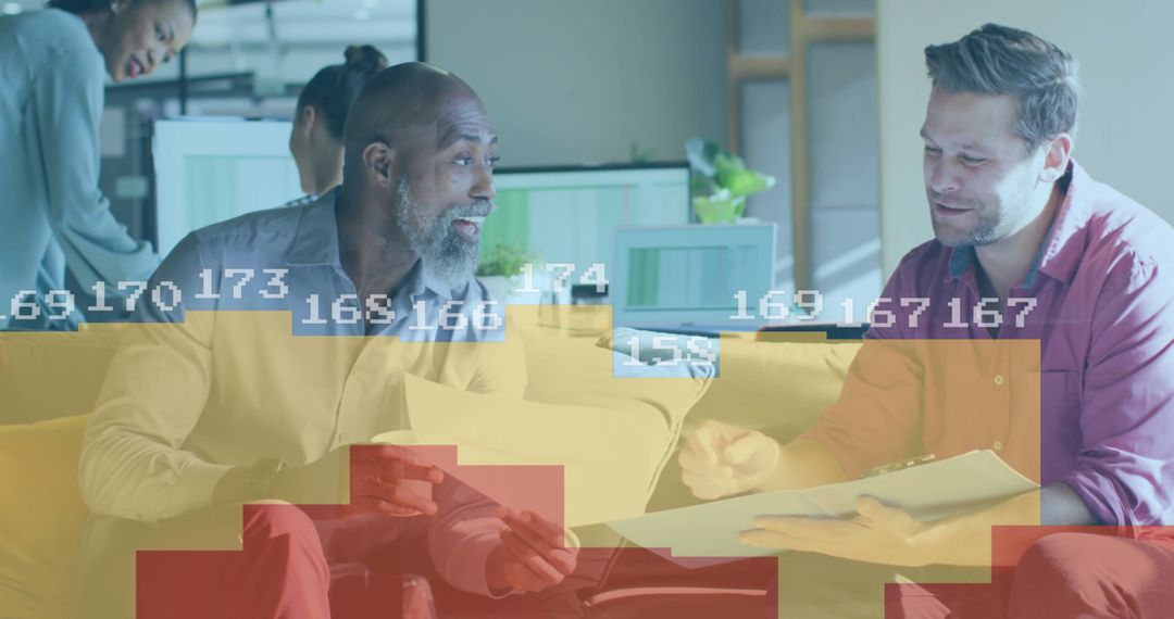 Diverse Colleagues Discussing Business Data in Modern Office