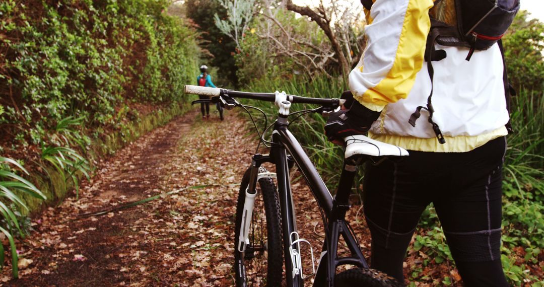 Cyclists Enjoying Forest Trail in Autumn - Free Images, Stock Photos and Pictures on Pikwizard.com