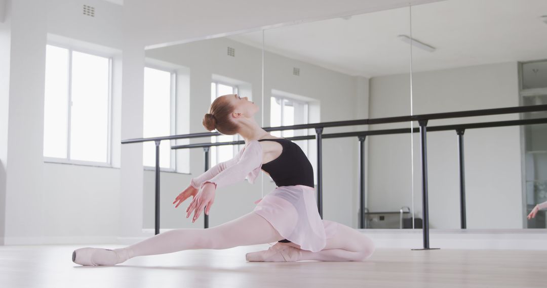 Young Ballet Dancer Performing Graceful Pose in Studio - Free Images, Stock Photos and Pictures on Pikwizard.com