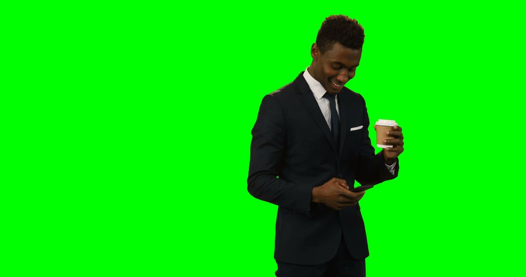 Young Professional Holding Coffee and Smartphone on Green Screen Background - Free Images, Stock Photos and Pictures on Pikwizard.com