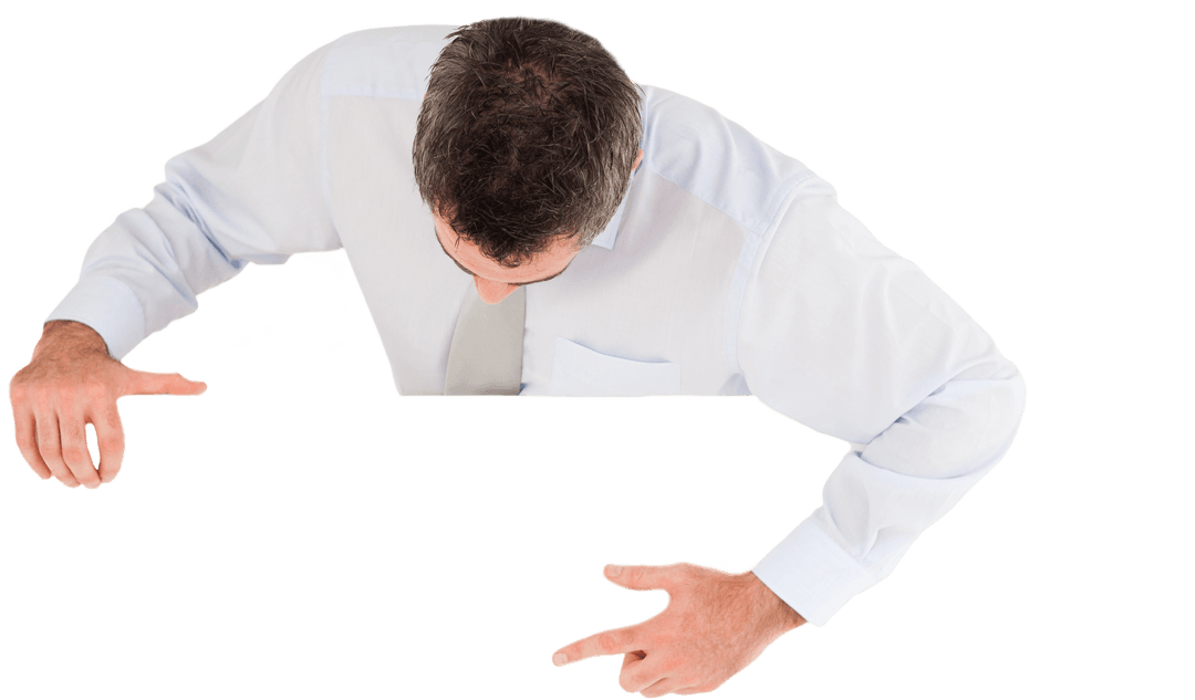 Businessman Pointing Downward to Transparent Space Concept