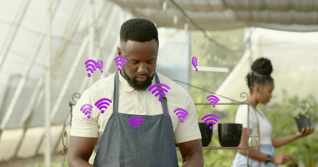 Greenhouse gardener inspecting plants with purple wireless icons visualizing smart farming connectiv
