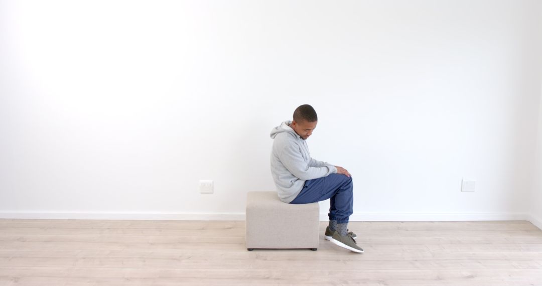 African American Man Exercising with Step Box for Home Workout