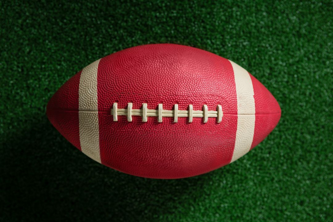 Close-up of American football on artificial turf - Free Images, Stock Photos and Pictures on Pikwizard.com