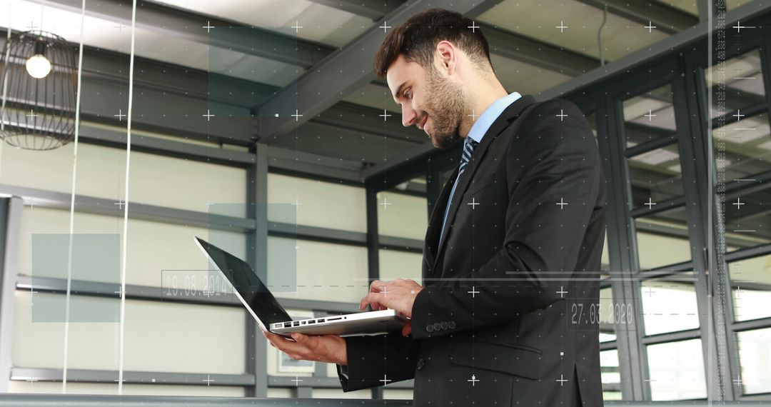 Businessman Using Laptop in Modern Office - Free Images, Stock Photos and Pictures on Pikwizard.com