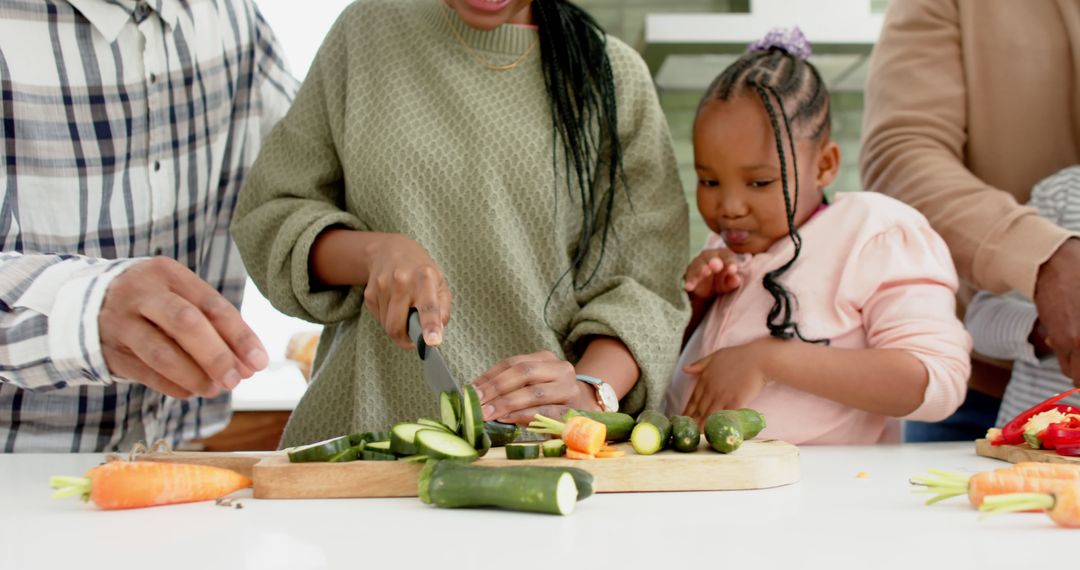 Family Preparing Fresh Vegetables Together in Kitchen - Free Images, Stock Photos and Pictures on Pikwizard.com