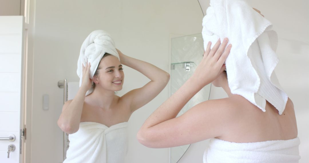 Woman Smiling after Shower Wrapping Hair in Towel - Free Images, Stock Photos and Pictures on Pikwizard.com